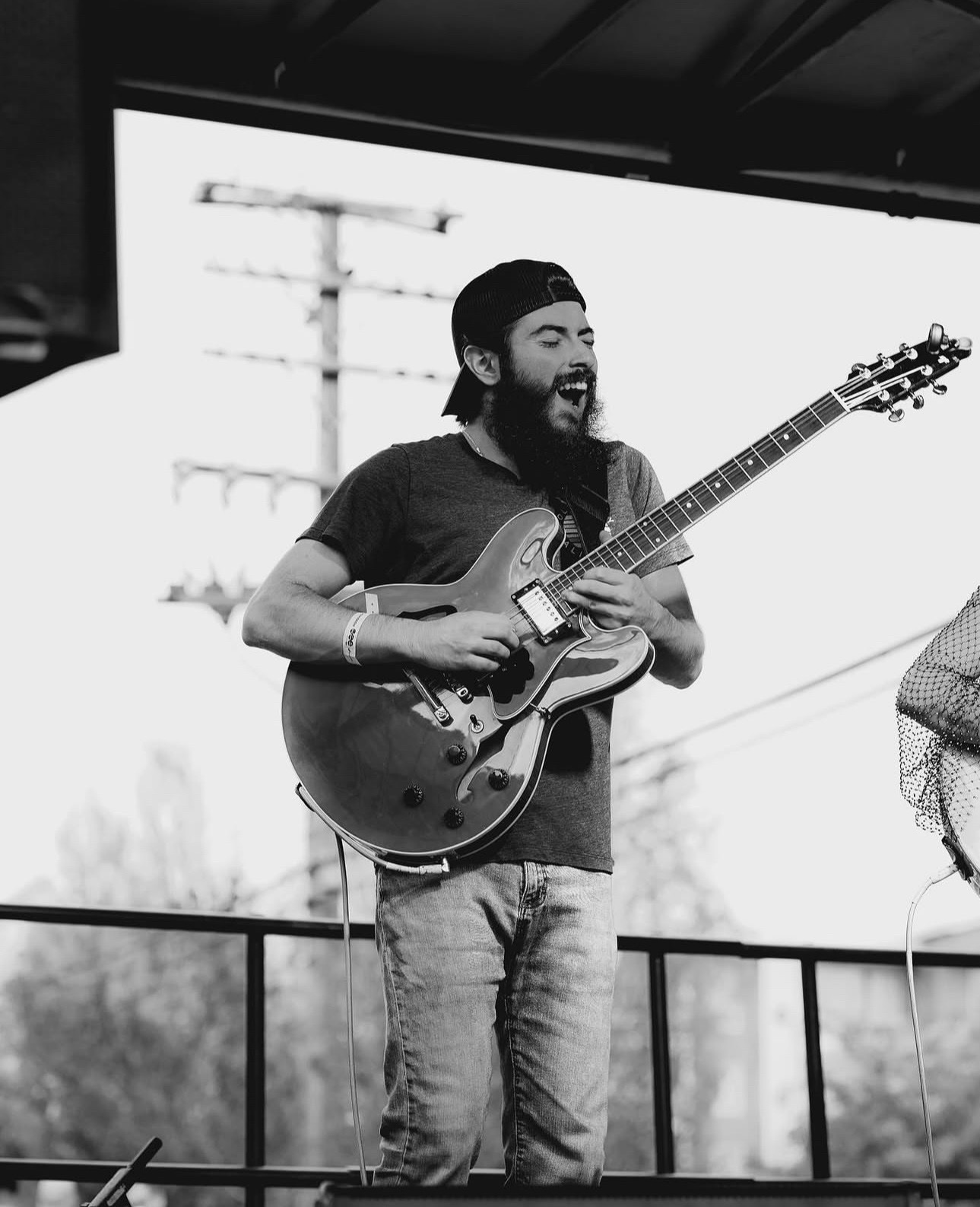 Mike Martin singing on stage with guitar